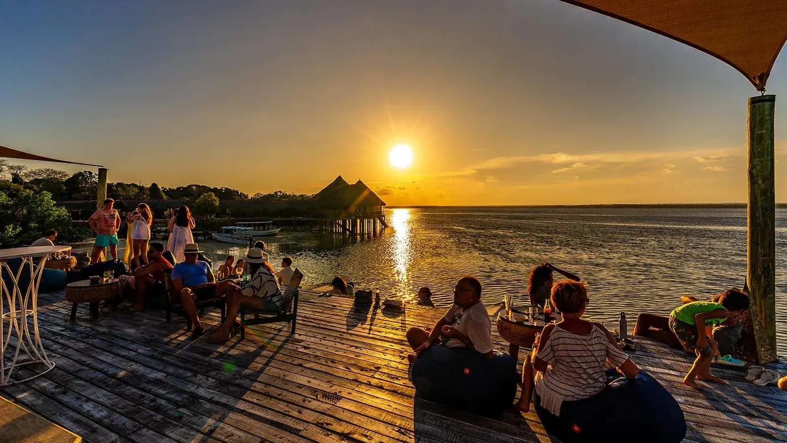 Guests enjoying a golden sundowner beside the Kenyan coast
